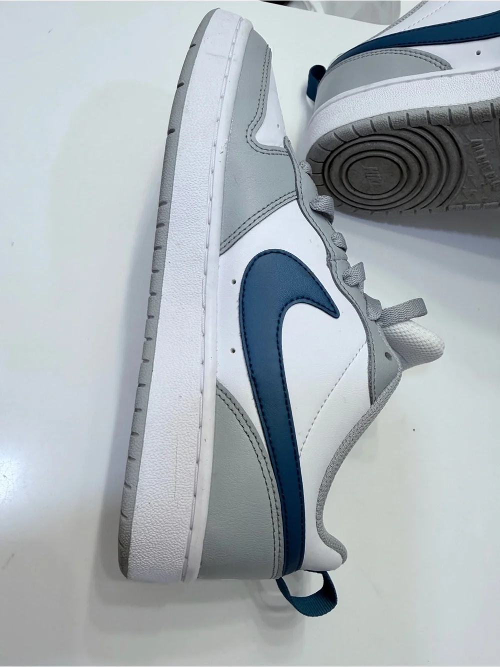 Nike Low-Top Sneakers in White, Gray, and Navy